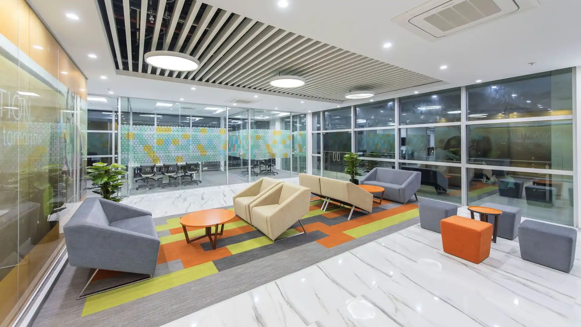 Office lounge with vibrant furniture and design.